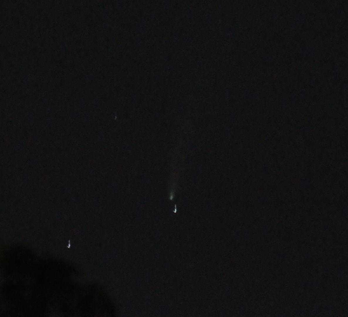 low-quality photo of the C/2020 F3 (NEOWISE) comet