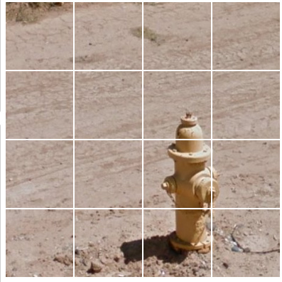 A fire hydrant on a dry, dusty road